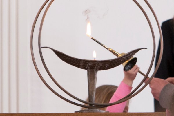 Chalice being lit by child